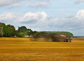 tractor spraying biosolids