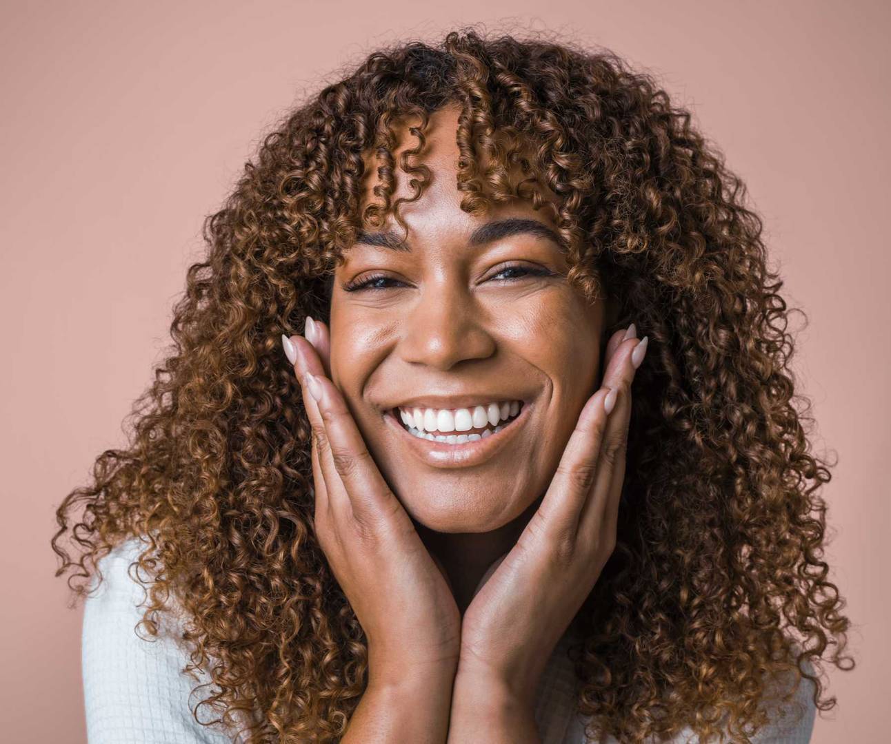 Female clinical testing panelist posing with hands on cheek