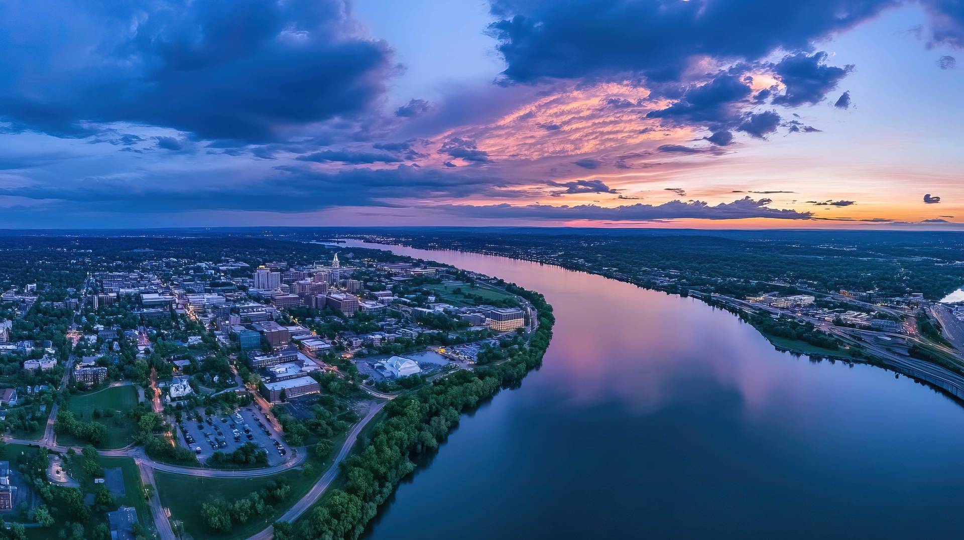 Expansive perspective showing the interface of water, land, and urban development, representing the diverse environments where our environmental testing services provide critical insights.