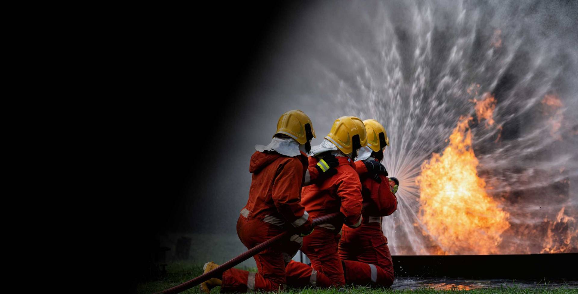 Firefighter spraying pfas foam