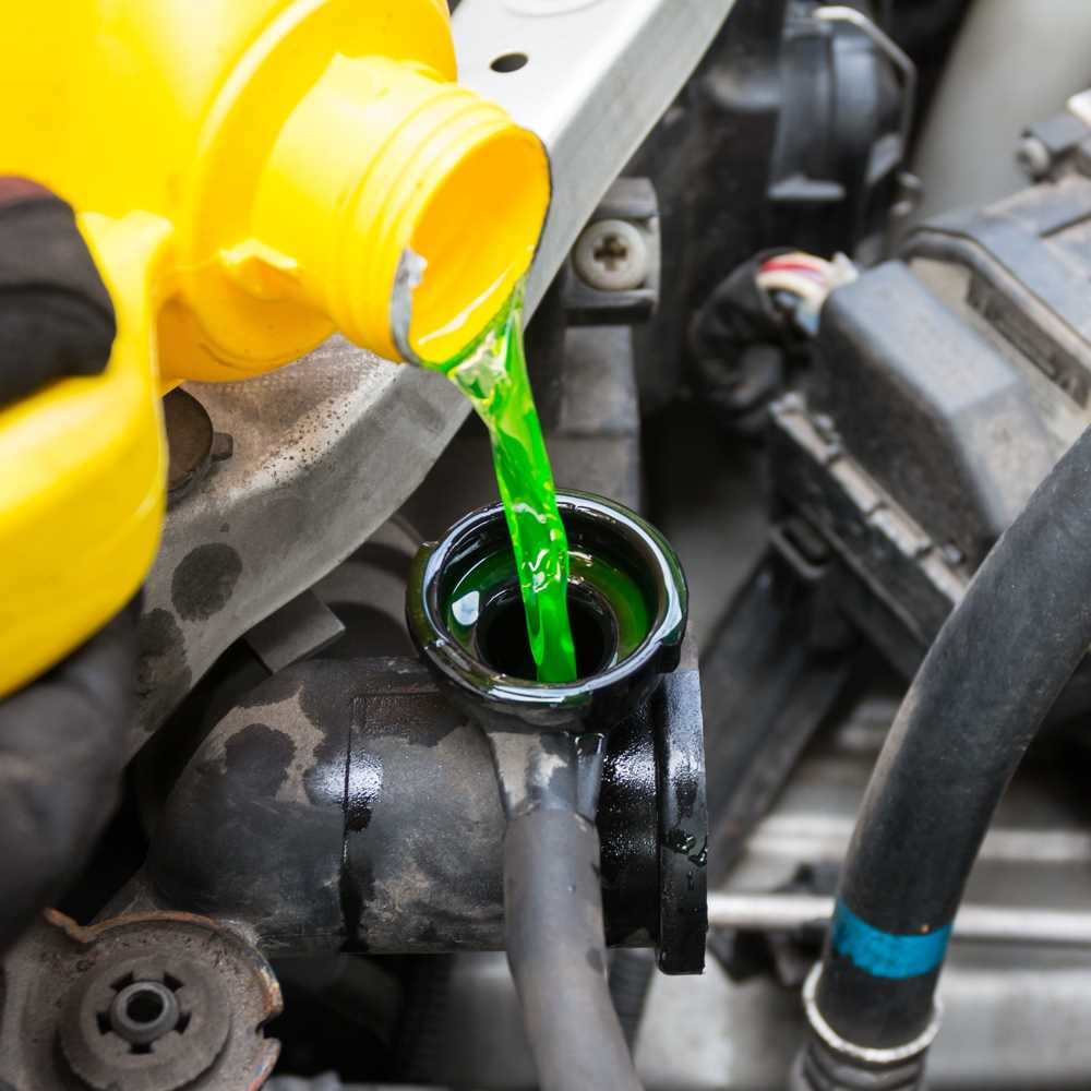 coolant being poured into engine